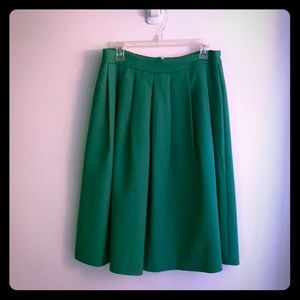 Bright green pleated skirt